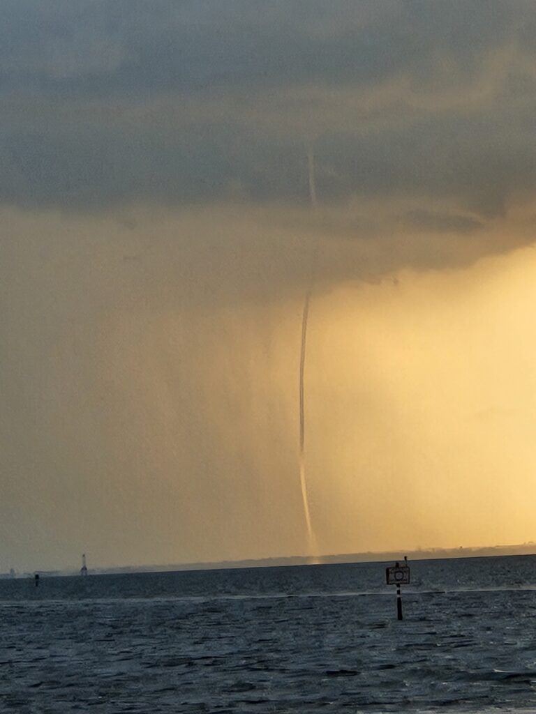A waterspout touching down over the water off Bahia Beach in Ruskin, Florida