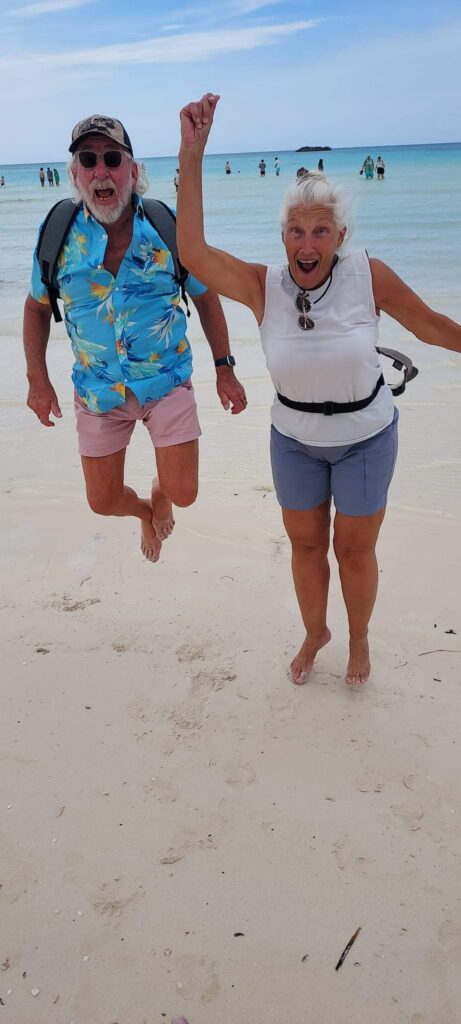 Shawna Calvert's parents jumping in the air together on a Florida beach
