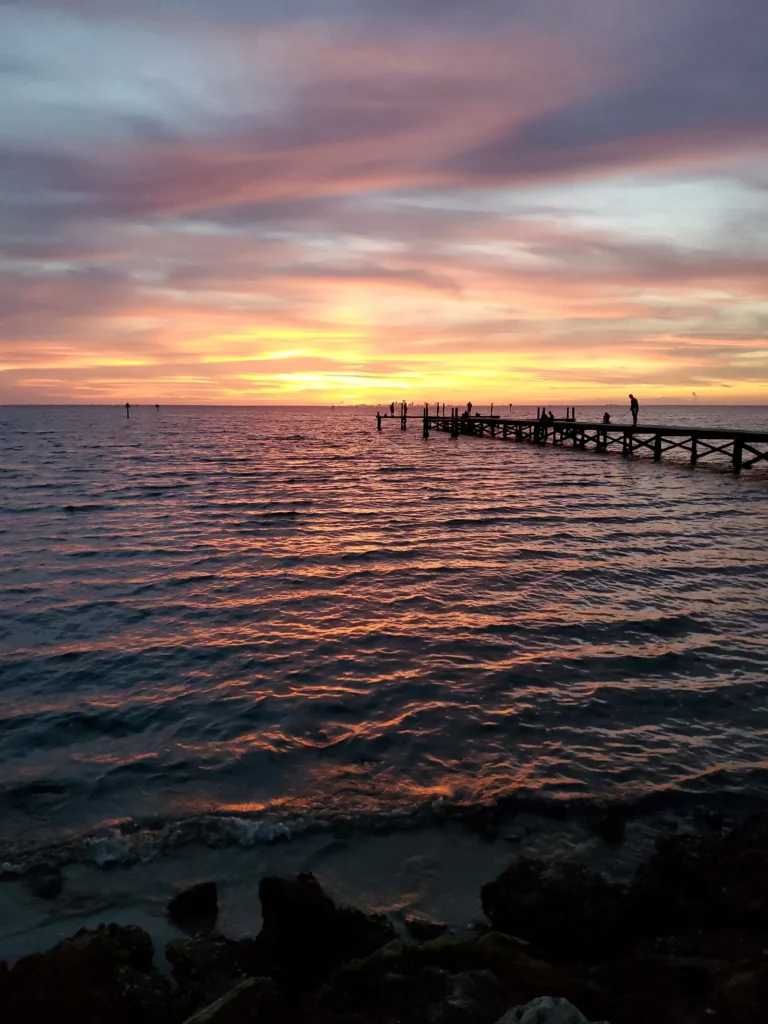 Sunset over Tampa Bay from a fishing pier in Apollo Beach