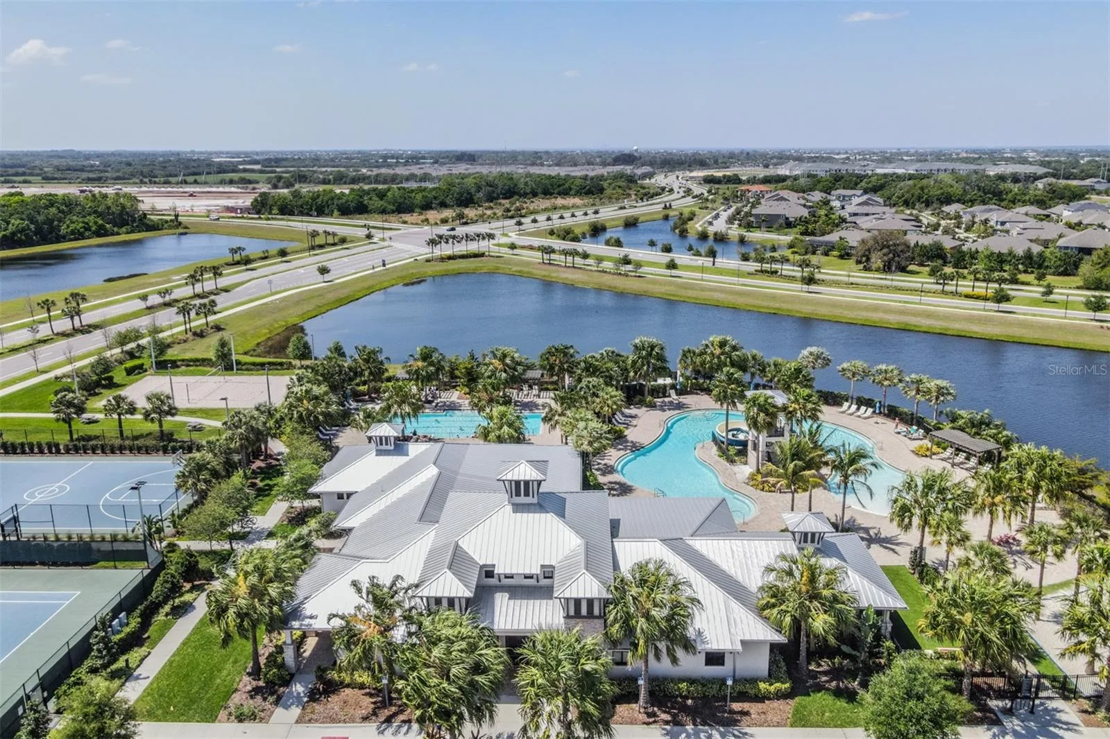 Aerial view of Covington Park homes around a retention pond in Apollo Beach