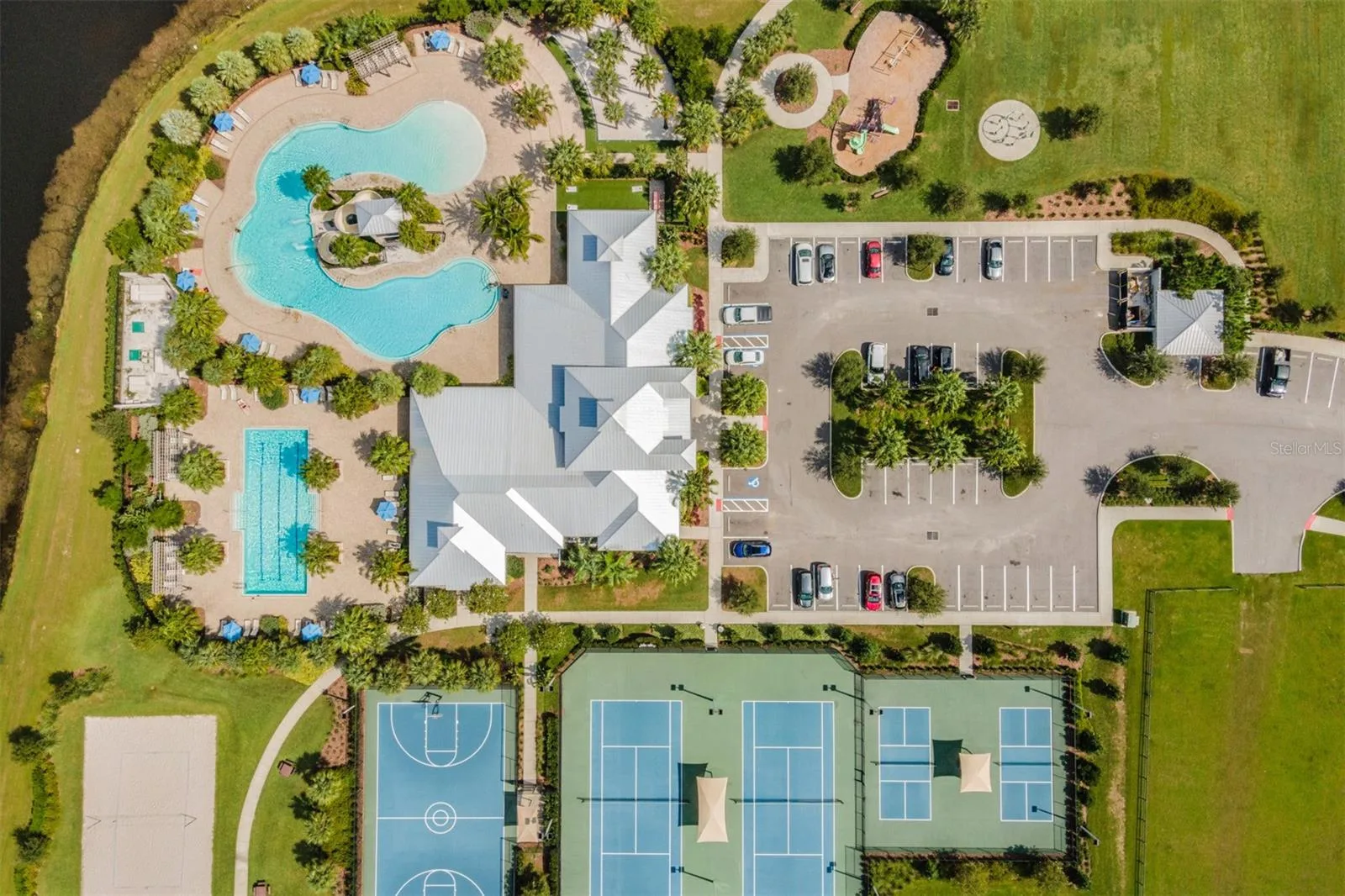 Aerial view of the lap pool and lagoon pool at Covington Park in Apollo Beach