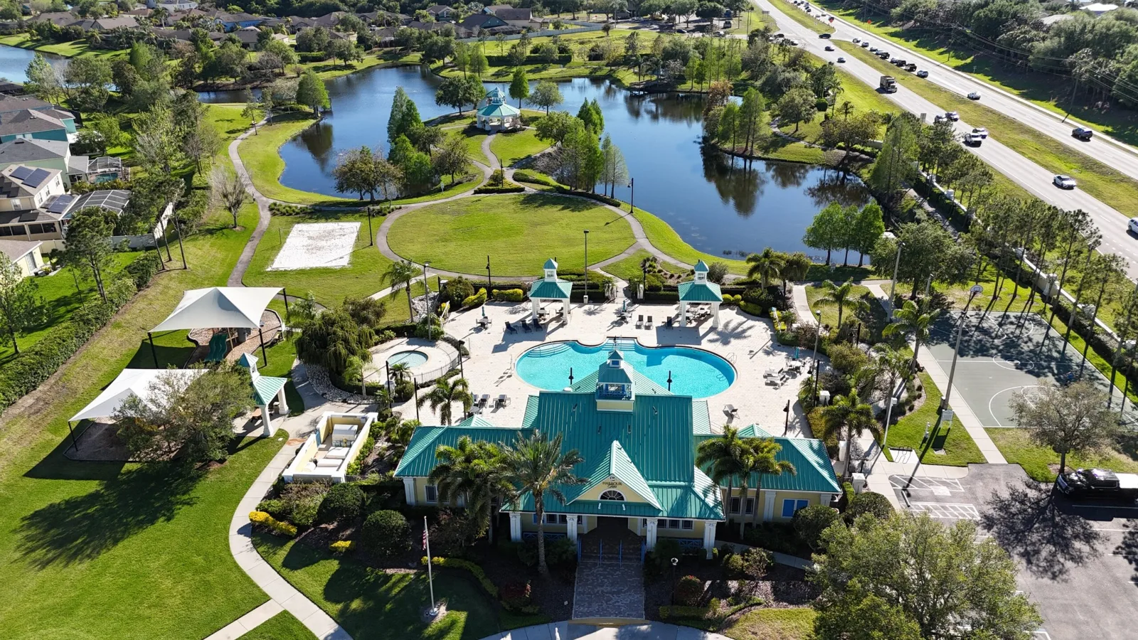 Aerial view of the lakefront clubhouse and pool at Harbour Isles in Apollo Beach