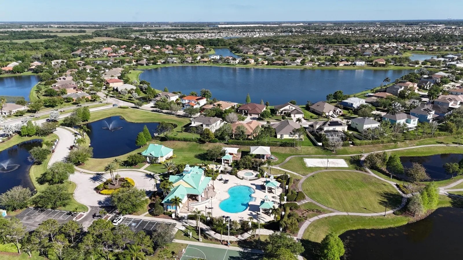 Aerial view of the Harbour Isles clubhouse, pool and surrounding homes in Apollo Beach