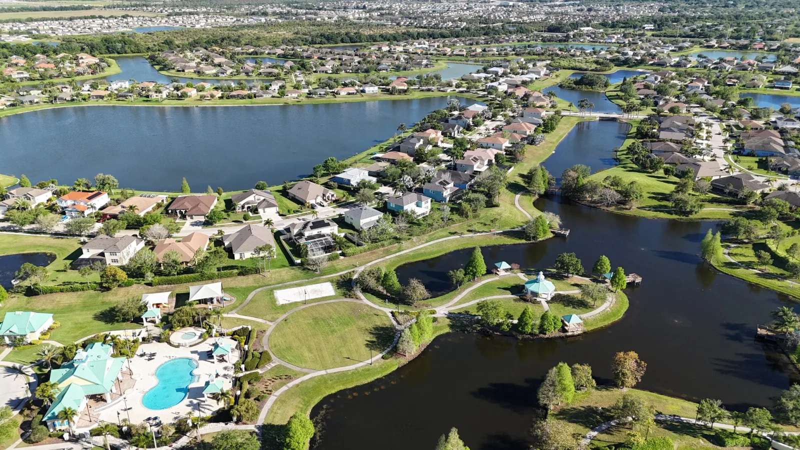 Aerial view of Harbour Isles homes around the community lake in Apollo Beach