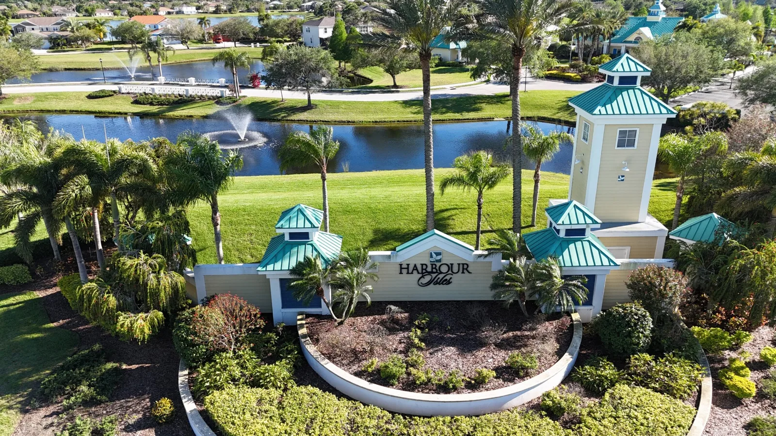 The Harbour Isles pool and clubhouse seen across the community lake in Apollo Beach