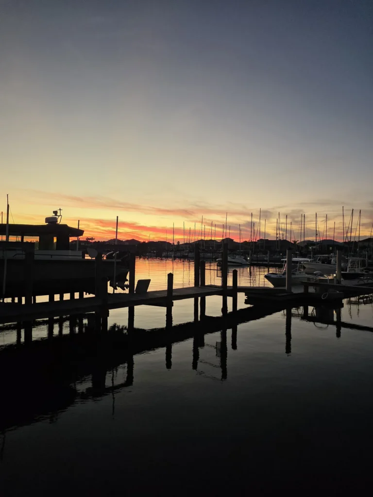 Sailboat masts at sunset in a Tampa Bay marina