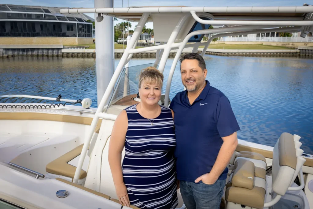 Shawna and Gregg Calvert of 27North Realty aboard their boat in Apollo Beach