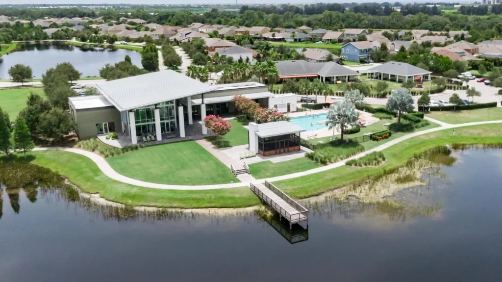 Aerial view of a Waterset clubhouse across the lake in Apollo Beach
