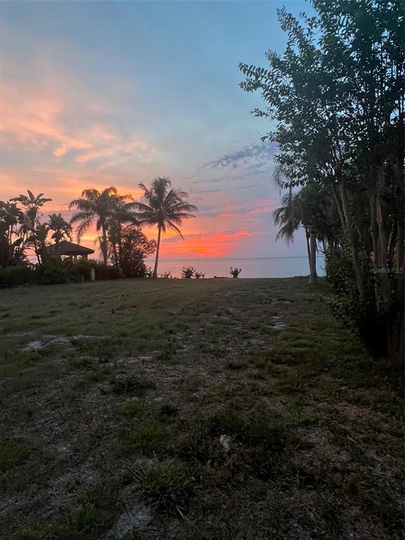 Sunset over Tampa Bay from the beachfront lot at 1013 Symphony Isles Boulevard