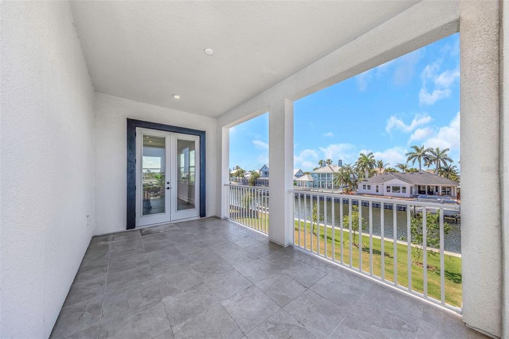 Upstairs balcony with canal views at 1016 Signet Drive