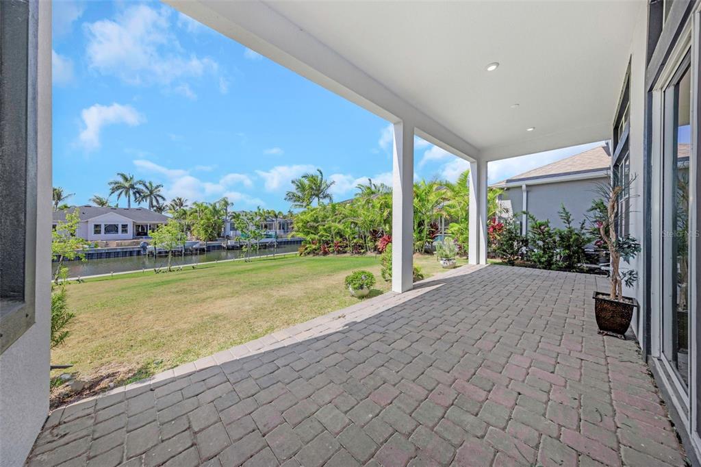 Covered lanai overlooking the canal at 1016 Signet Drive
