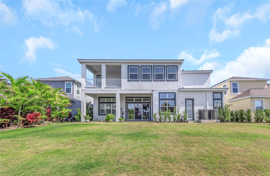 Open backyard running to the new seawall at 1016 Signet Drive, room to add a dock and pool