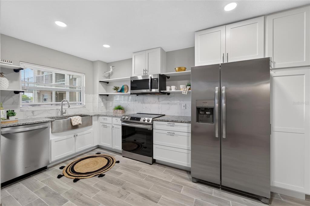Kitchen with induction stove and farmhouse sink