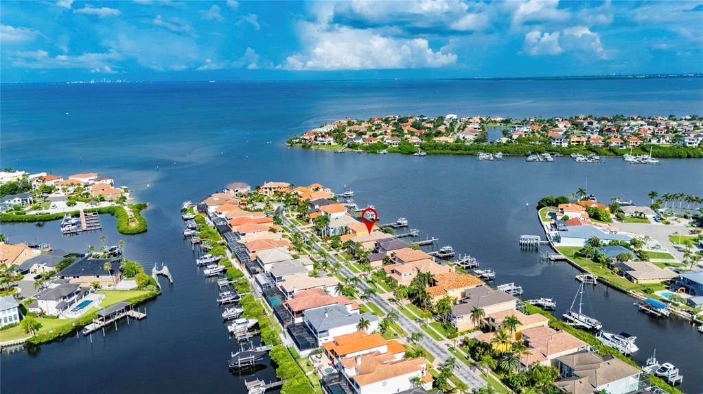 Aerial view of 1231 Acappella Lane on a deep-water canal in Symphony Isles, Apollo Beach
