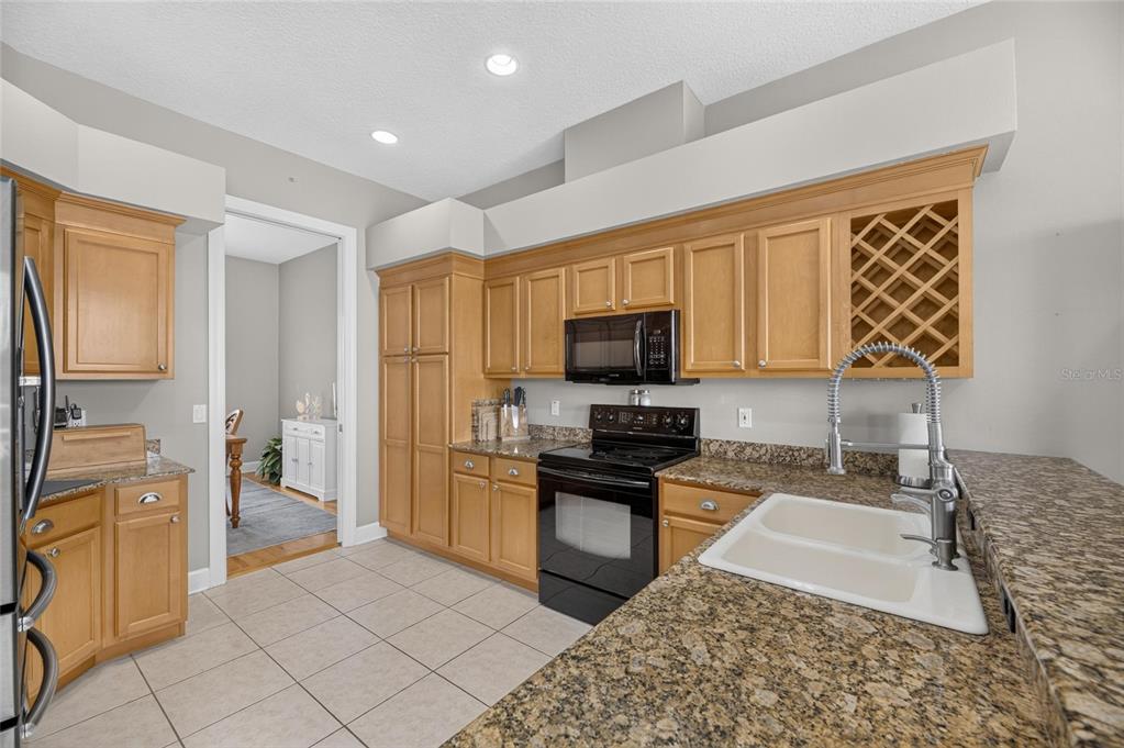 Kitchen with stainless appliances and built-in pantry