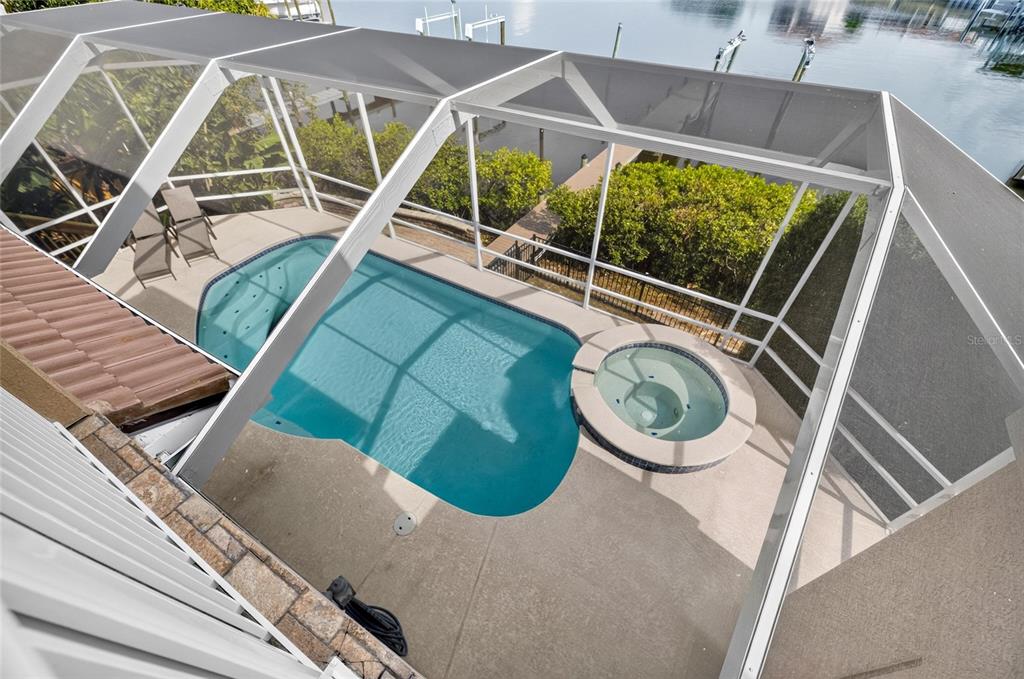 Aerial view of the pool, dock and canal at 1231 Acappella Lane