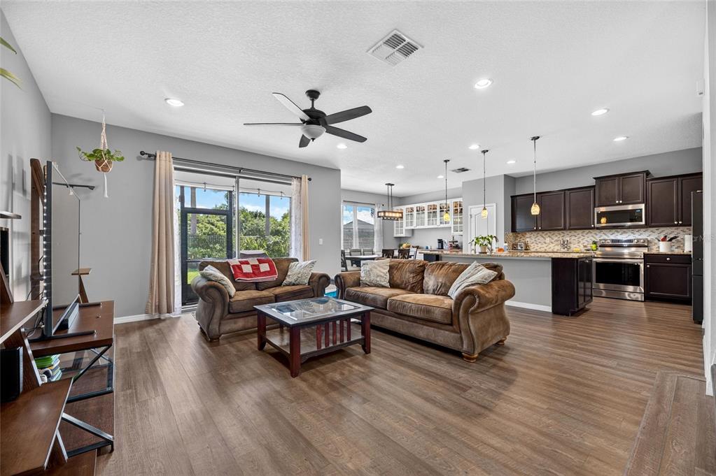 Living room with luxury vinyl floors and high ceilings