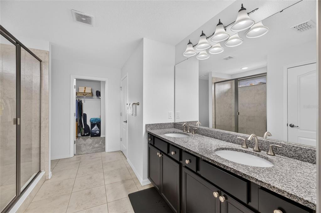 Primary bath with dual sinks and walk-in shower