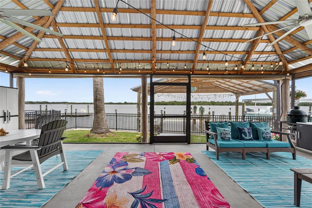 Covered outdoor living area overlooking the water