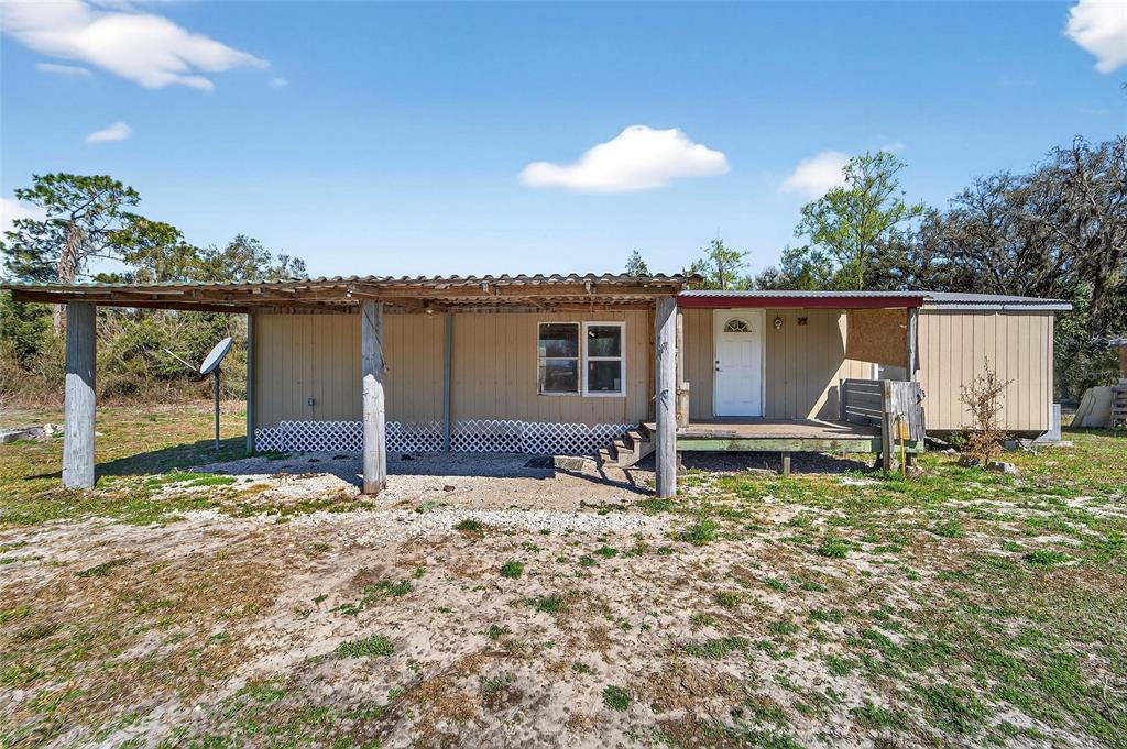 Front of the manufactured home at 35238 Manuel Street on 5 fenced acres in Webster, FL