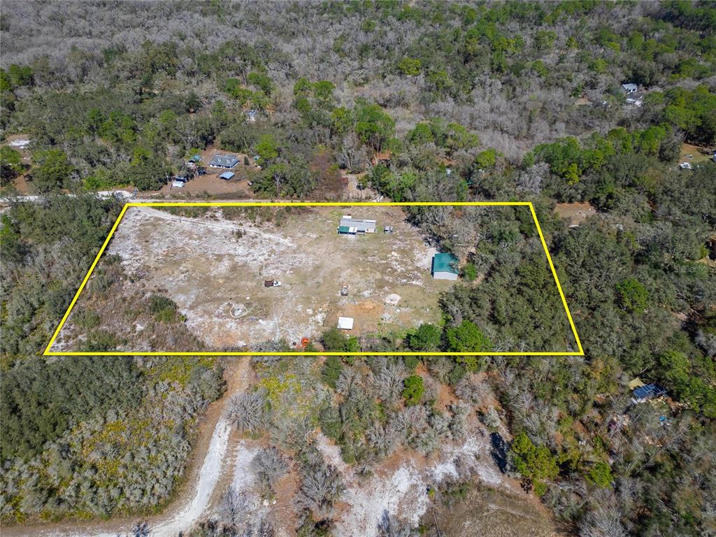 Aerial of the 5-acre parcel at 35238 Manuel Street in Webster with the boundary outlined