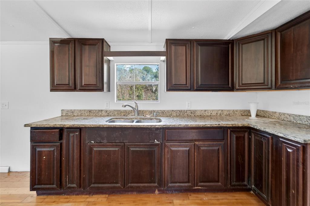 Kitchen with solid wood cabinets at 35238 Manuel Street, Webster
