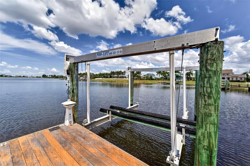 Boat lift and dock at sunset