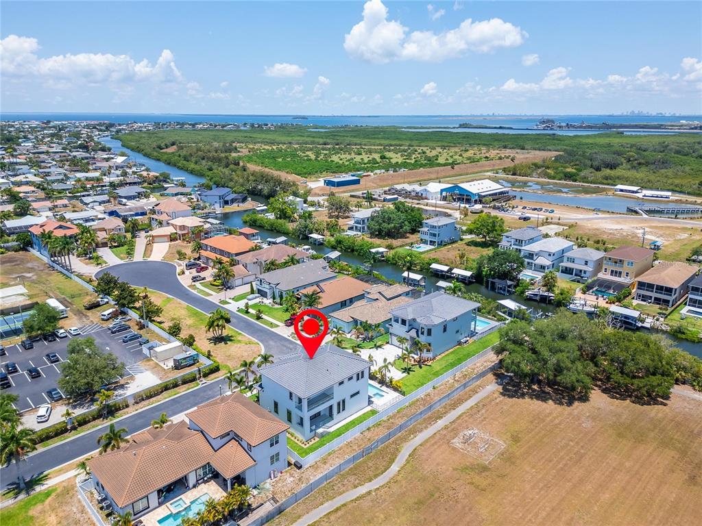 Aerial locating 517 Treviso Drive in Apollo Beach on the canal network