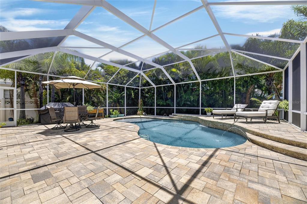 Aerial view of the heated pool and screened lanai