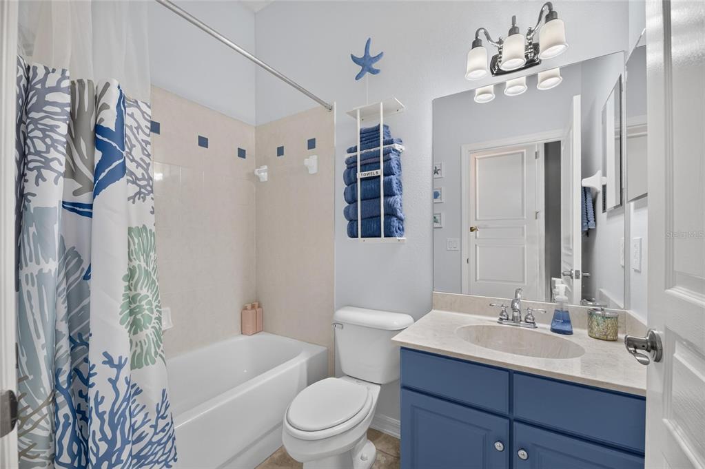 Primary bath with dual stone vanities