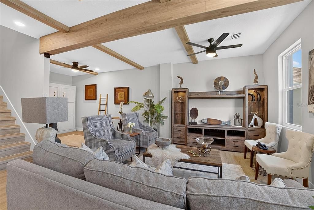 Open living room with exposed wood beams at 525 19th Street NW, Ruskin
