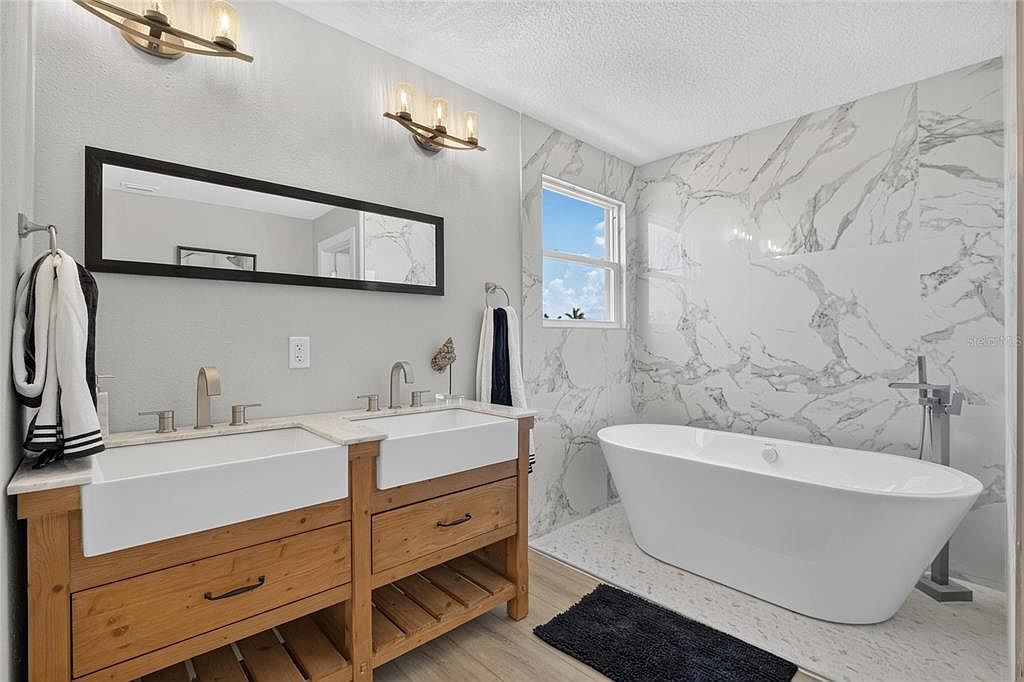 Primary bath with a freestanding soaking tub at 525 19th Street NW, Ruskin