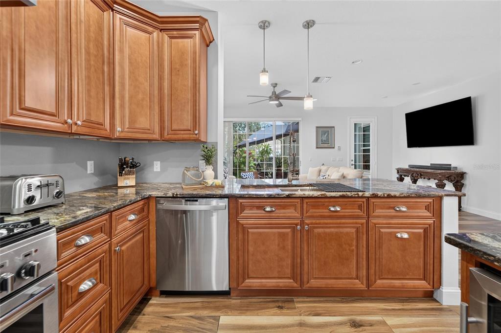 Renovated chef’s kitchen with granite and 42-inch cabinets