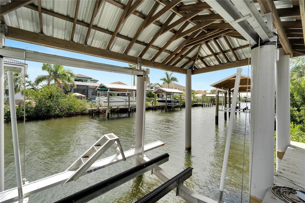 Covered deck and dock on the saltwater canal at 534 Estuary Shore Lane, Apollo Beach