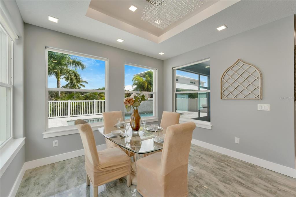 Sunny dining area with chandelier
