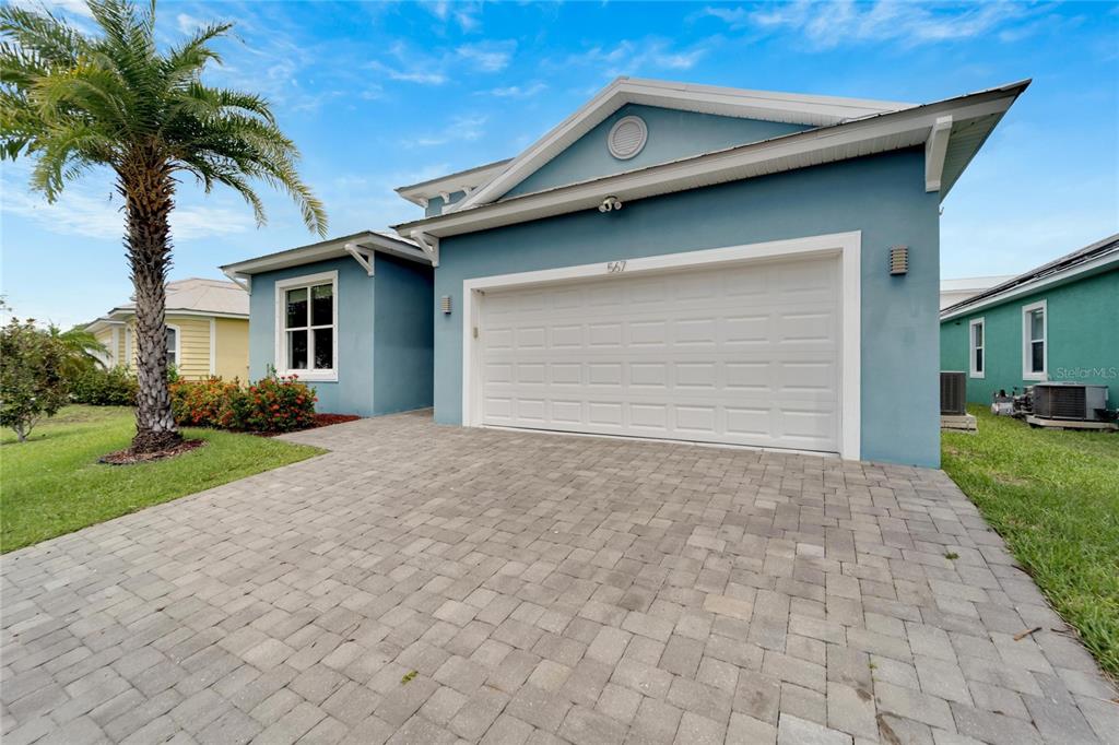 Front of 567 Bimini Bay Boulevard with paver driveway