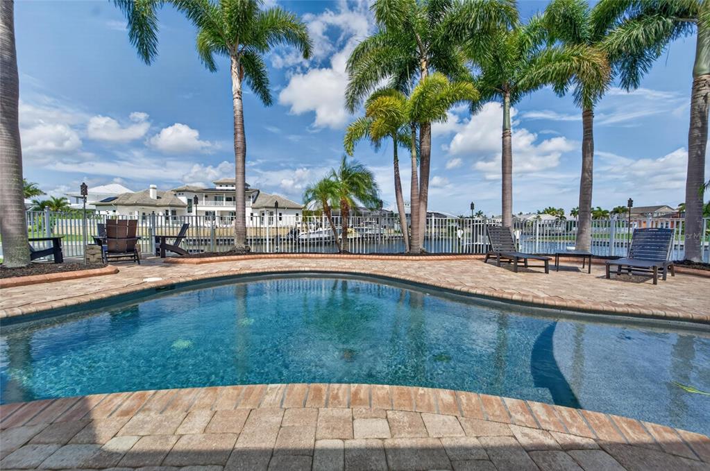 Aerial view of the pool and canal at 5722 Sea Trout Place, MiraBay, Apollo Beach