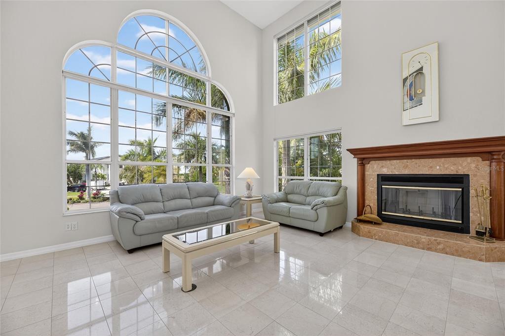 Living room with soaring ceilings and marble floors