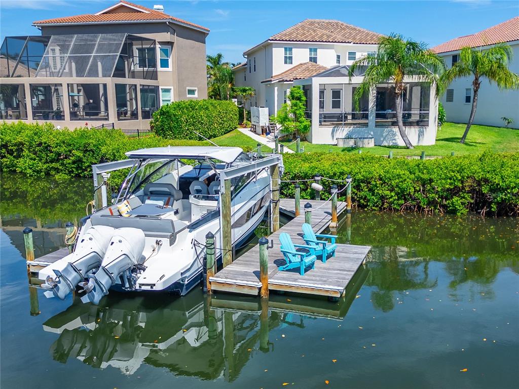 Aerial of 6203 Marbella Boulevard in Andalucía, Apollo Beach, with the dock, boat lift and saltwater canal