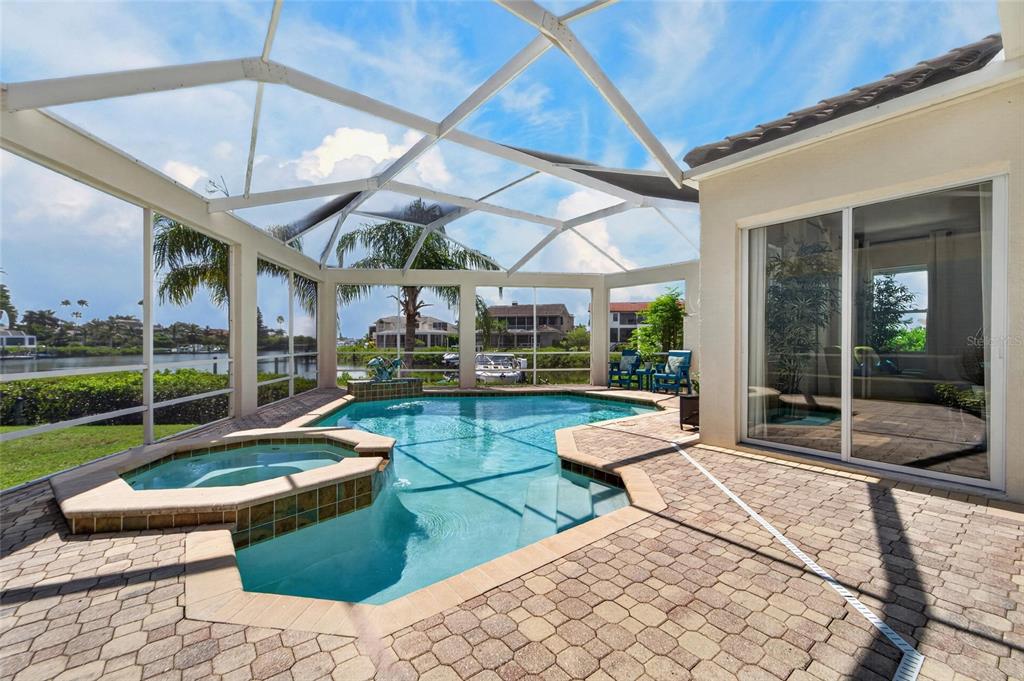 Screened pool deck with canal views at 6203 Marbella Boulevard, Andalucía
