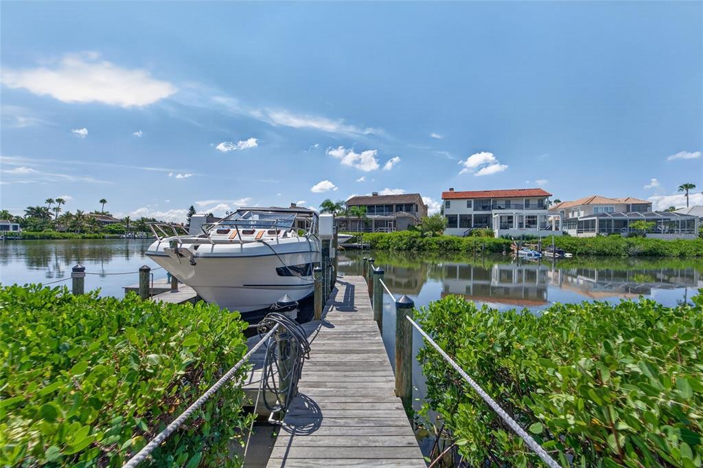 Private dock with a rebuilt 13,000 pound boat lift at 6203 Marbella Boulevard