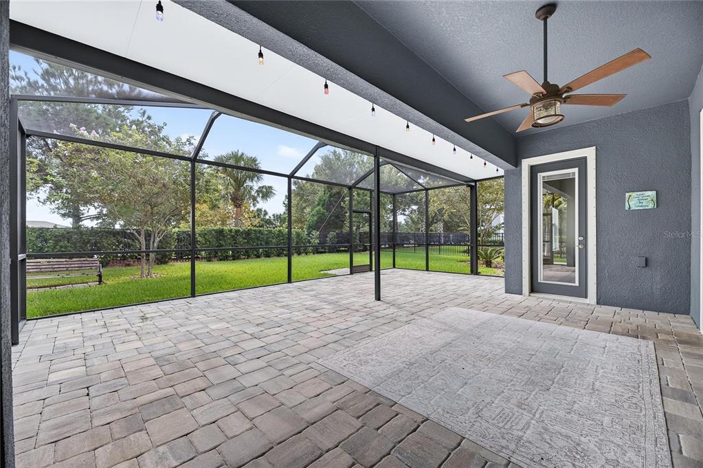 Screened lanai with brick and stone floor
