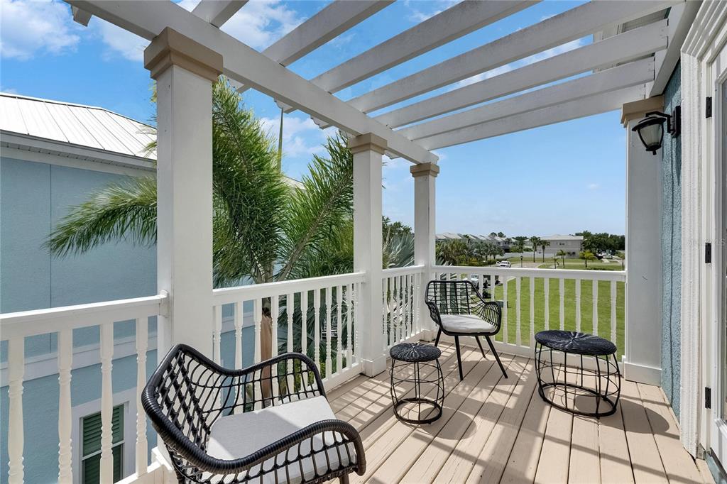 Upper balcony overlooking the water at 6512 Simone Shores Circle