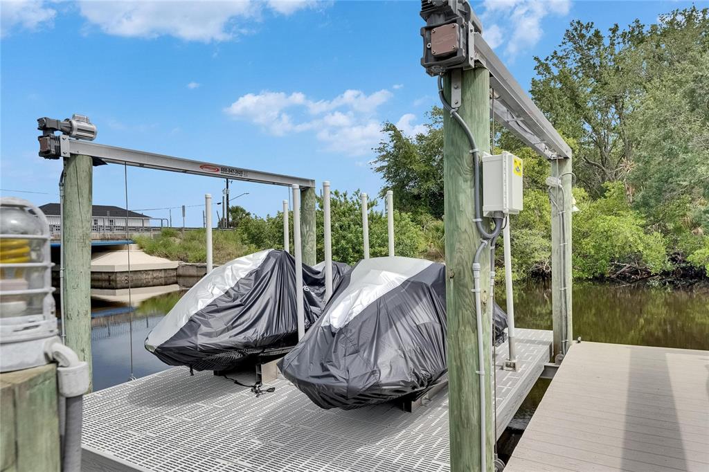 Double jet ski lift on the canal at 6512 Simone Shores Circle, Apollo Beach