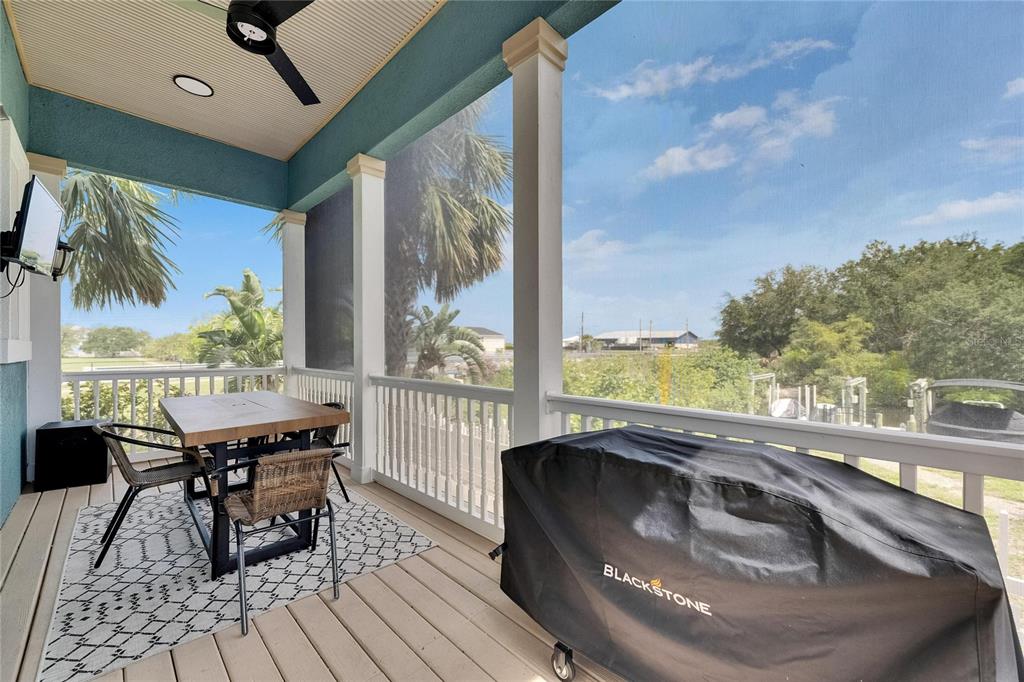 Covered lanai with drop-down screens at 6512 Simone Shores Circle