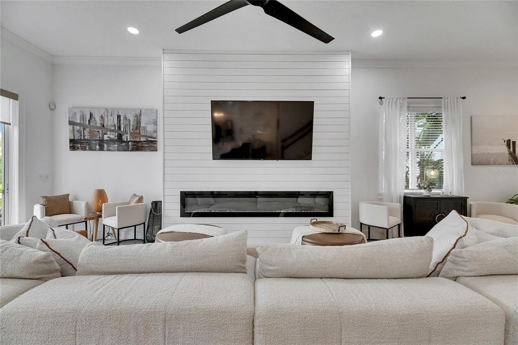 Living room with electric fireplace at 6512 Simone Shores Circle, Apollo Beach