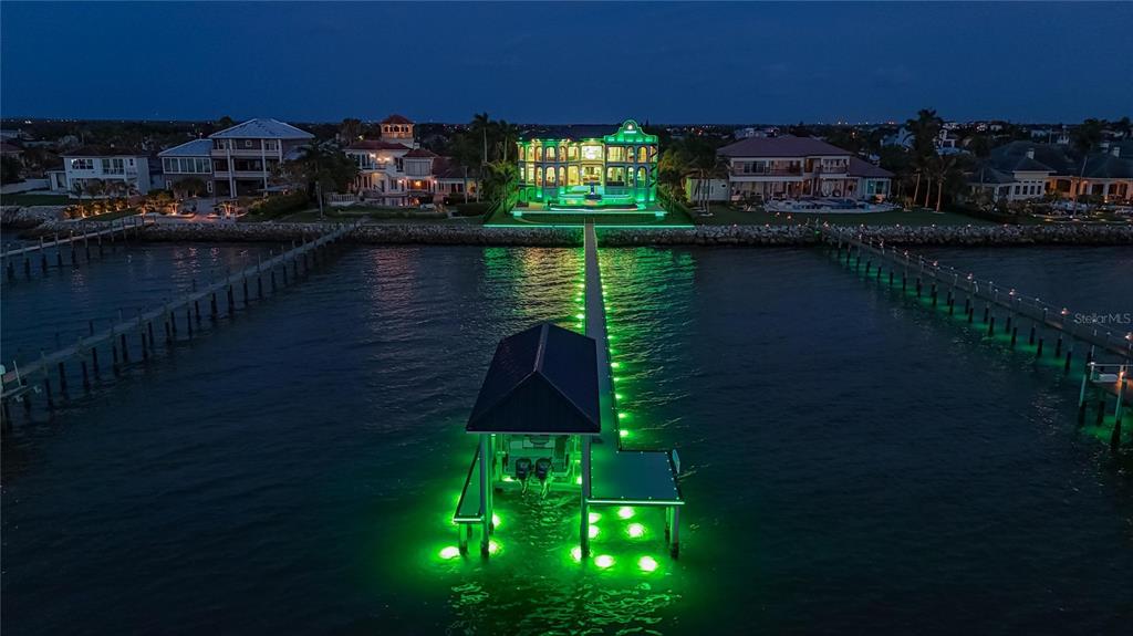 6526 Surfside Boulevard lit at night with programmable exterior lighting