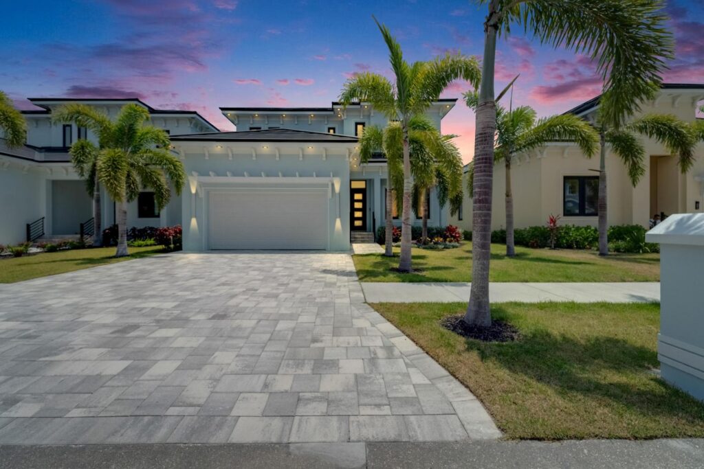 Front elevation at dusk of the Bistro Builders home at 6530 Simone Shores Circle in Hemingway Estates, Apollo Beach