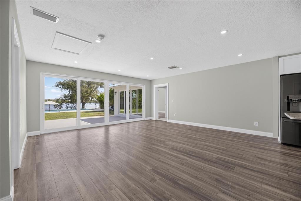 2023 family room addition with glass doors to the deck at 6712 Myrna Drive