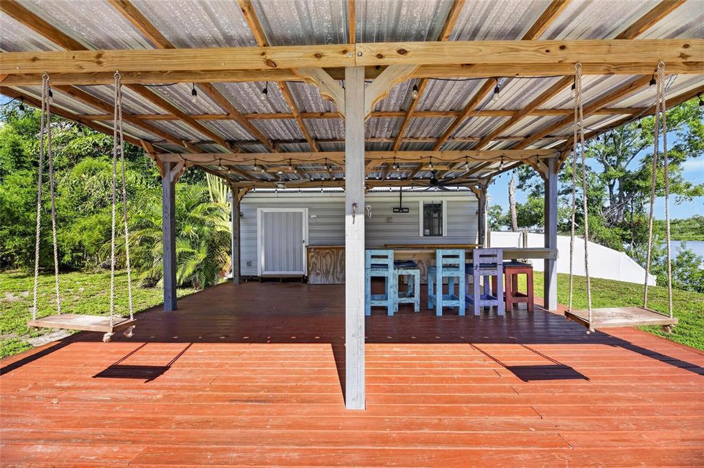 Covered cabana with built-in swings at 6712 Myrna Drive